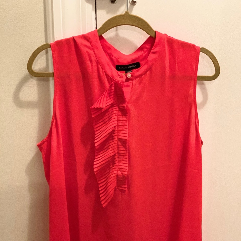 Red sleeveless ruffled on 1 side button down
